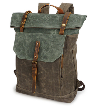 Retro canvas roll-top backpack in olive green with teal green flap, brown straps and buckle, three-quarter view