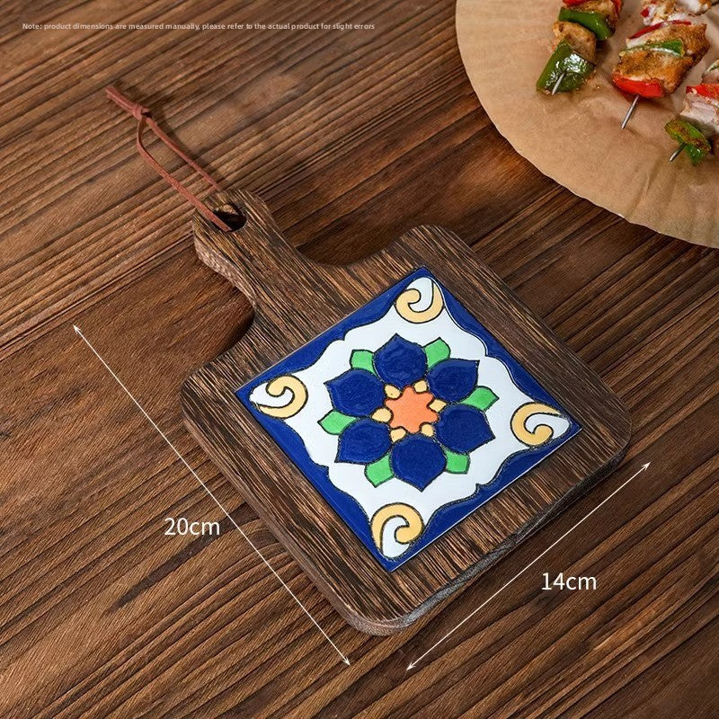Wood trivet with a blue lotus tile on planks, marked 20 cm by 14 cm