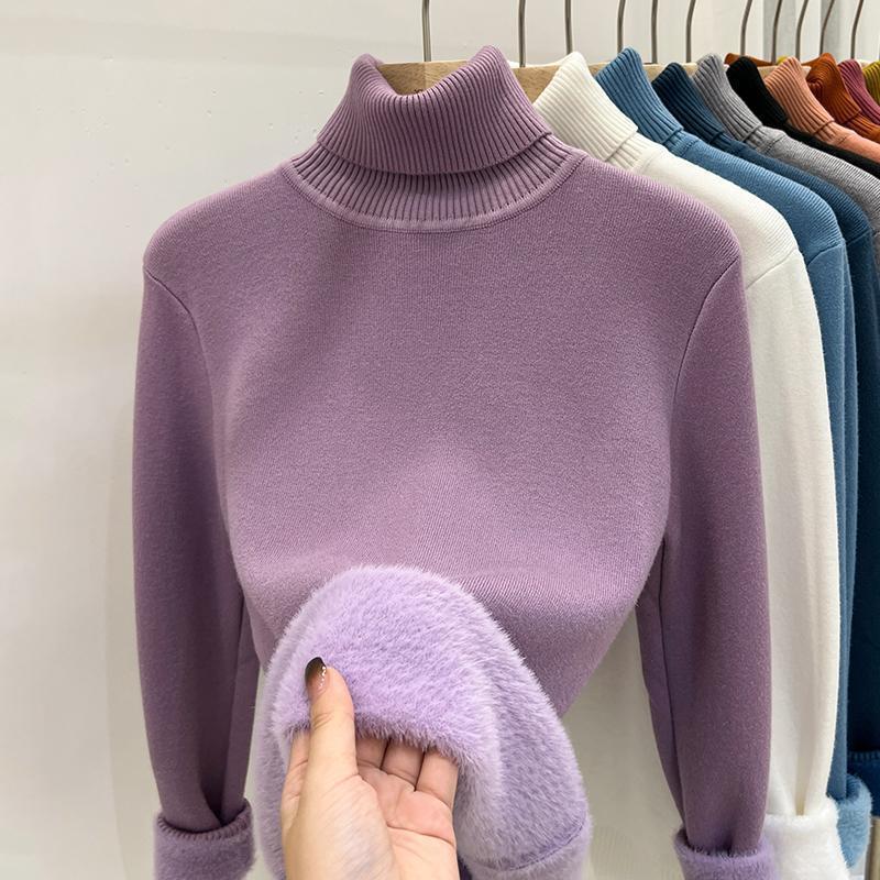 Pink Purple high collar sweater with a hand showing the lilac plush lining and ribbed cuff