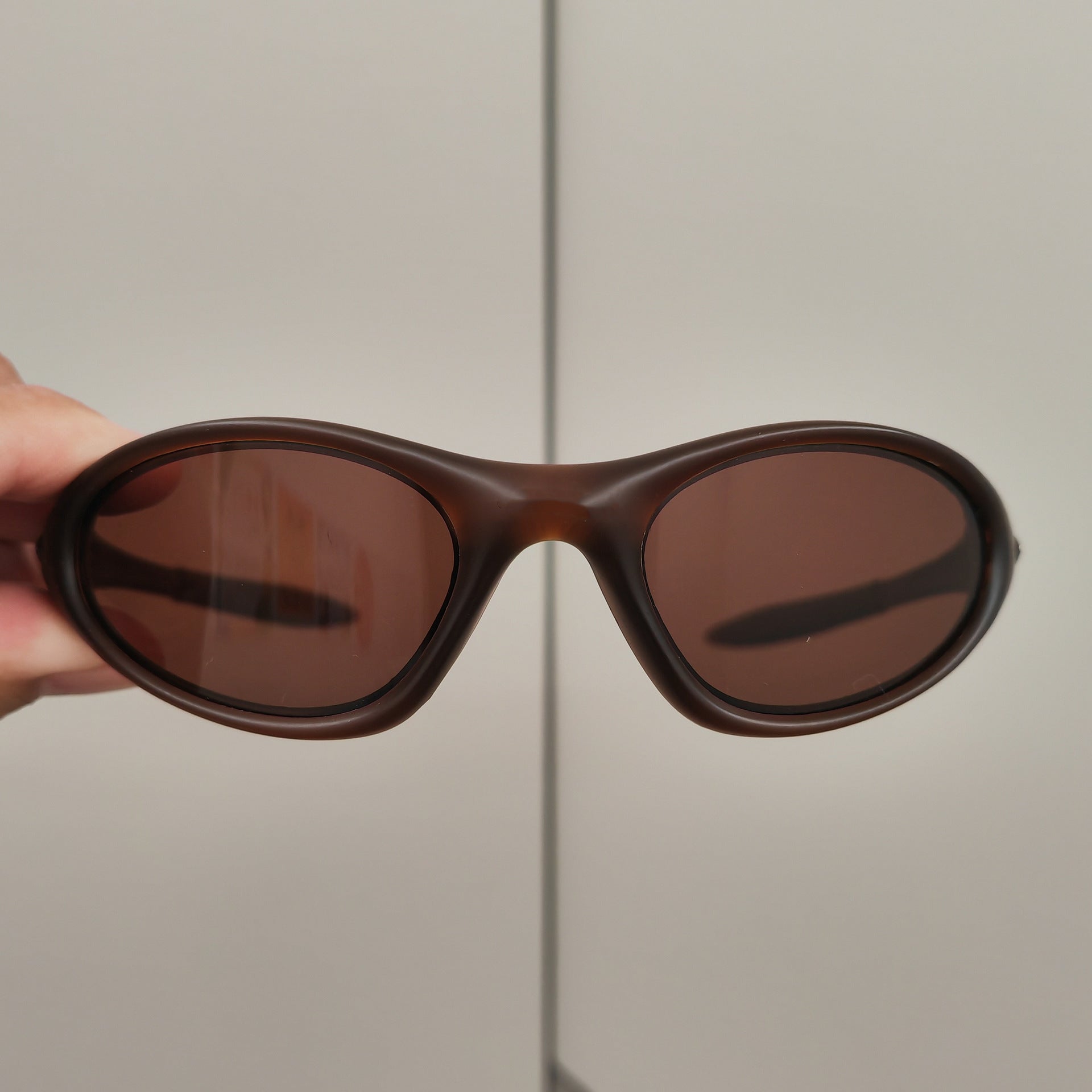 Retro Small Frame UV Protection Sunglasses | scale reference with hand