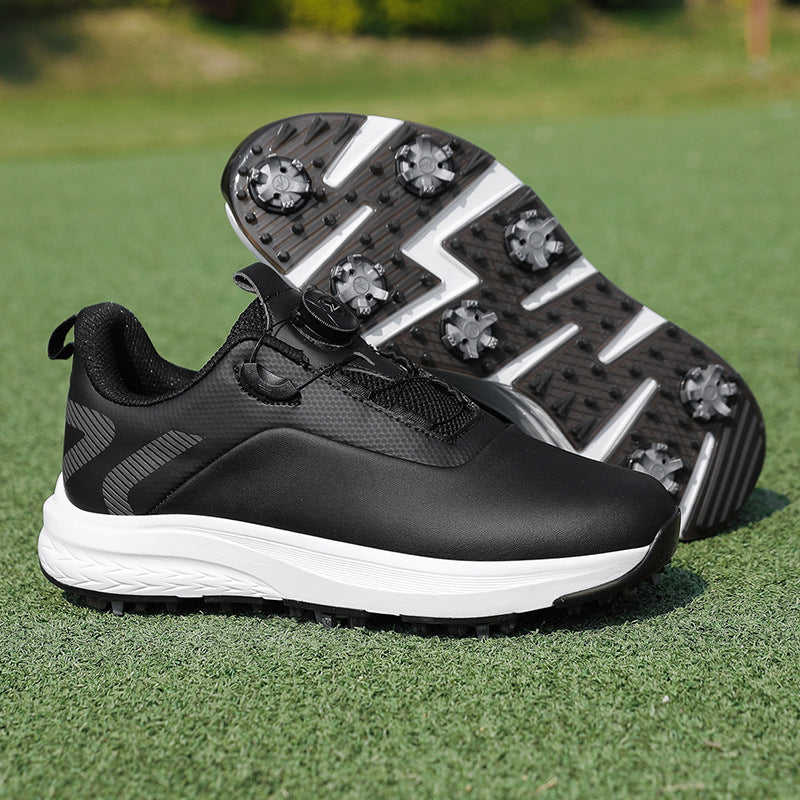 Black golf shoe with a twist dial closure and a spiked outsole with star shaped cleats