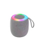 Bluetooth speaker on an outdoor table acting as a mood lamp with rhythm light