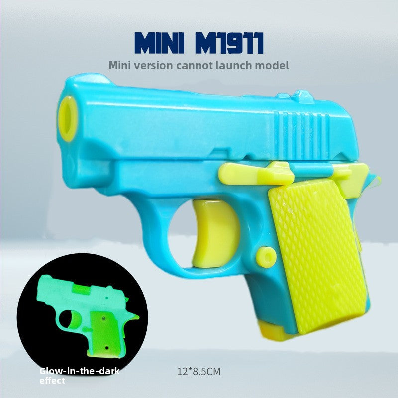 Blue and yellow glow model pistol fidget with a dark inset showing the green glow, 12 by 8.5 cm