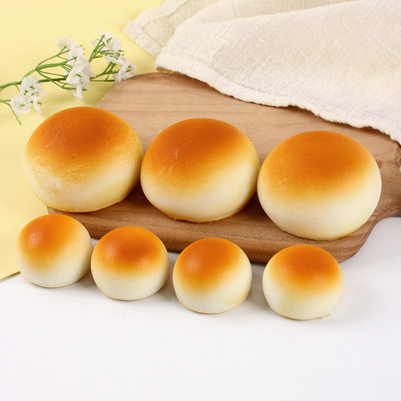 PU slow rebound squishy bread toy shaped like a golden bun and a sesame loaf