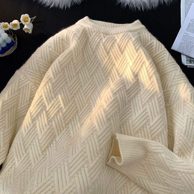 Apricot heavyweight basketweave knit pullover laid flat showing the raised woven texture
