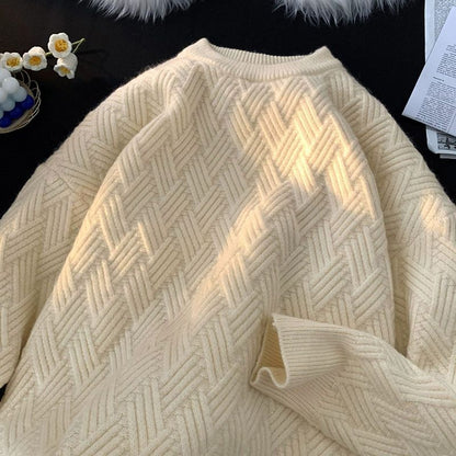Apricot heavyweight basketweave knit pullover laid flat showing the raised woven texture