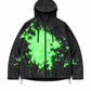 Black hooded zip jacket with fluorescent green splash ink print, chest zip pockets and hem cord