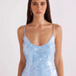 Blue sequin bodycon dress angled view highlighting the shimmer under low light