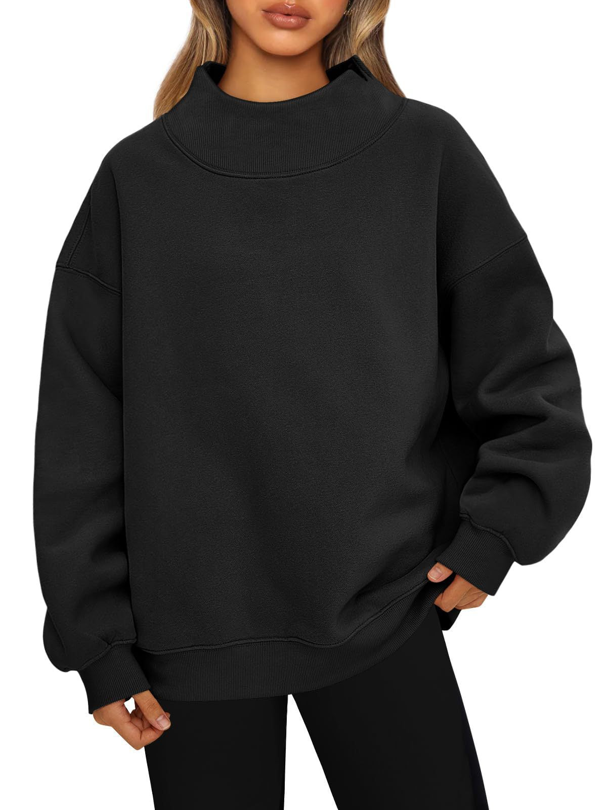 Black oversized mock neck sweatshirt with ribbed cuffs and hem, worn with black leggings, photo for size XXL