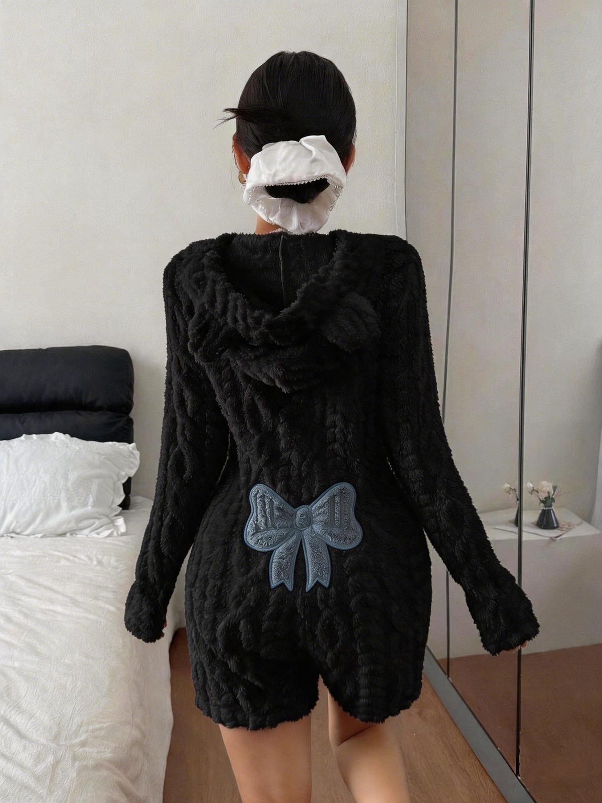 Black plush hooded romper with a blue bow patch on the back, size S option photo