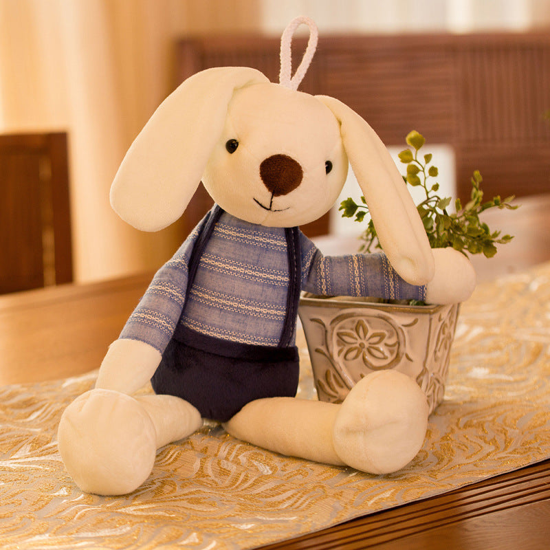 Cream plush rabbit in a periwinkle striped top and navy shorts beside a planter, Blue 60cm option