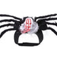 Plush black spider pet costume with eight furry legs and a skull rider on a cloth harness