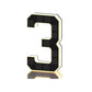 Black and gold solar LED house number sign, one character with a backlit warm outline, angled view