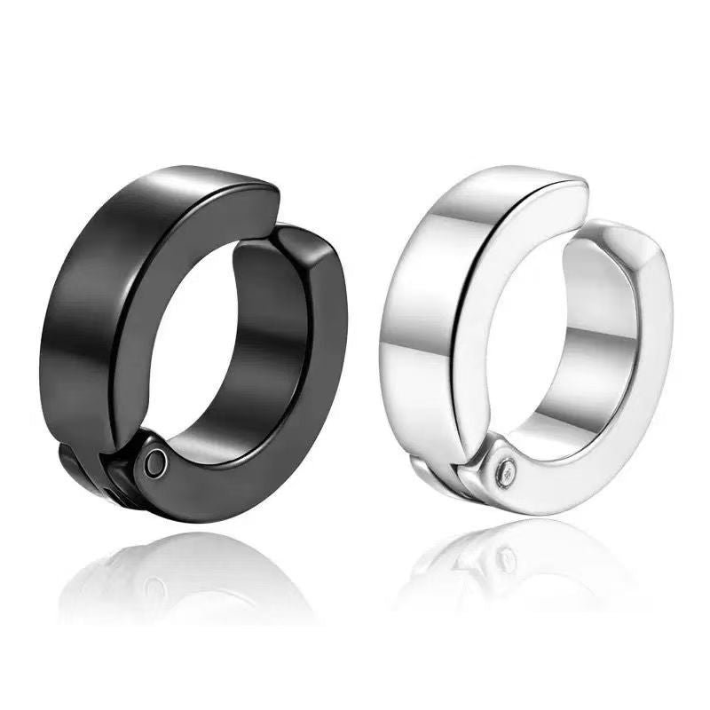 Black and steel clip on ear cuffs side by side, each with a hinge and a small pin on the outside of the ring