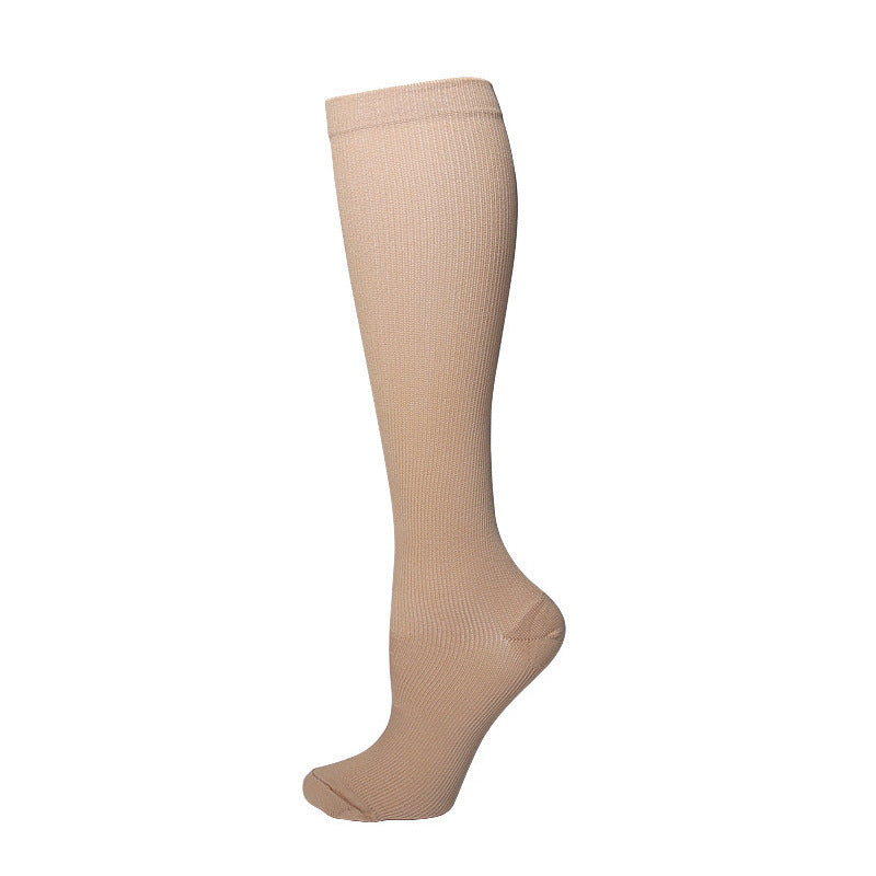 Navy mid calf nylon sport sock standing upright to show height and knit texture