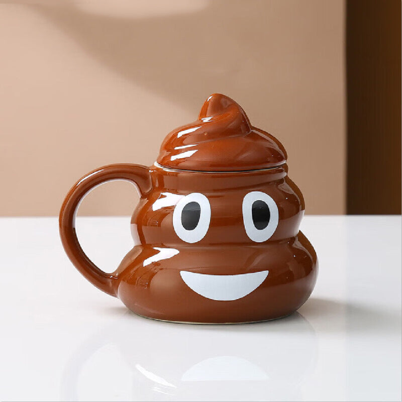 Brown ceramic poop shaped mug shown from the side with its soft serve style lid lifted off