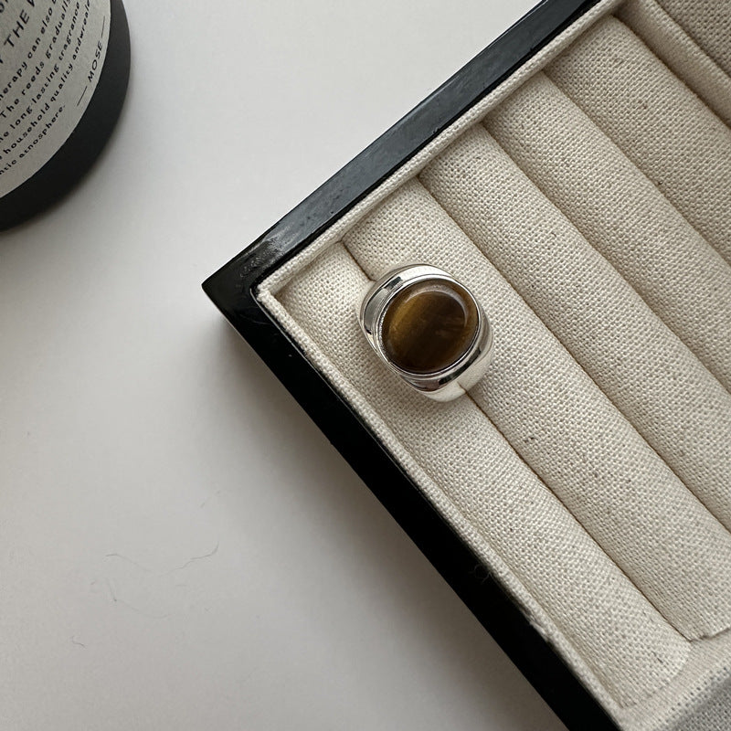 Open adjustable back of a sterling silver tiger eye ring