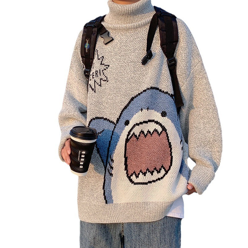 Light gray turtleneck sweater with a knitted blue shark, holding a coffee cup, on a white background