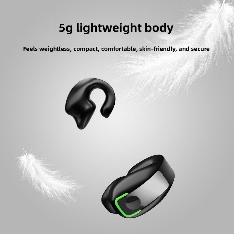 Two black clip-on earphones floating among white feathers on a grey background