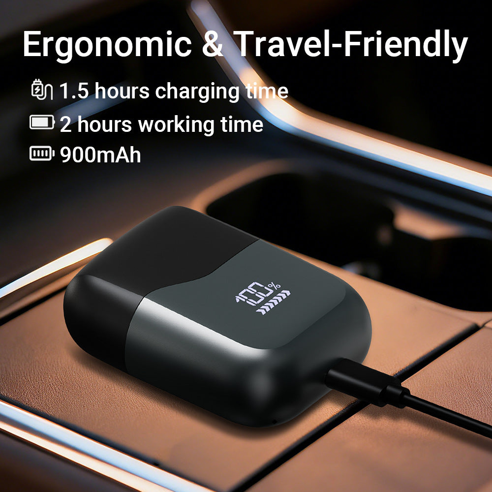 Black portable foil electric shaver held in the hand to show the compact size