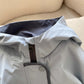 Close up of the hood, zipper and snap placket flap on the light blue boys hooded jacket