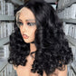 Lace front wig in natural black seen from a three quarter angle, sheer lace panel at the hairline