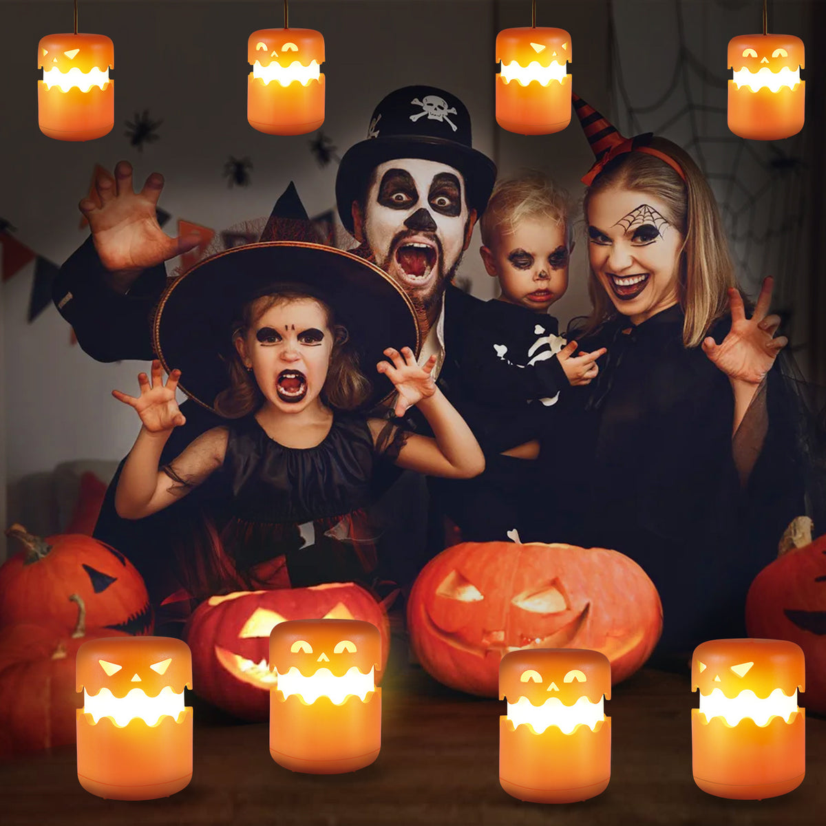 Family in Halloween costumes with lit pumpkin LED lanterns hanging and standing around them