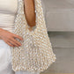 Side profile of the beaded crochet net bag showing the crocheted strap