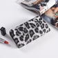 Animal print long wallet open to show the card and phone slot layout inside