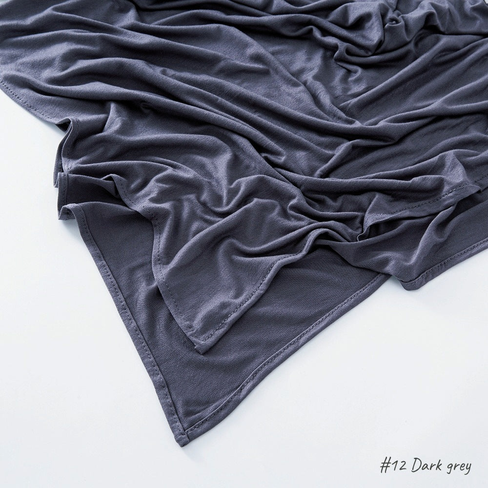 Modal cotton headscarf wrap with a narrow rolled hem running along the finished rectangular edge