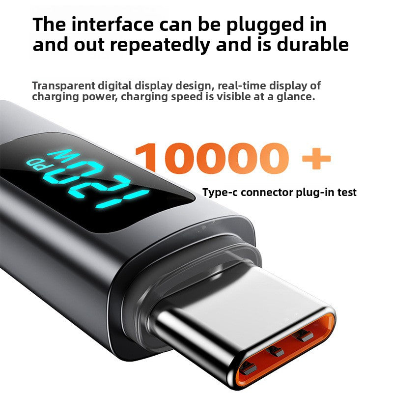 Closeup of the black connector with a lit 120W PD digital display and the USB-C plug tip