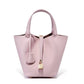 Close detail of the leather color and tone on the bucket tote