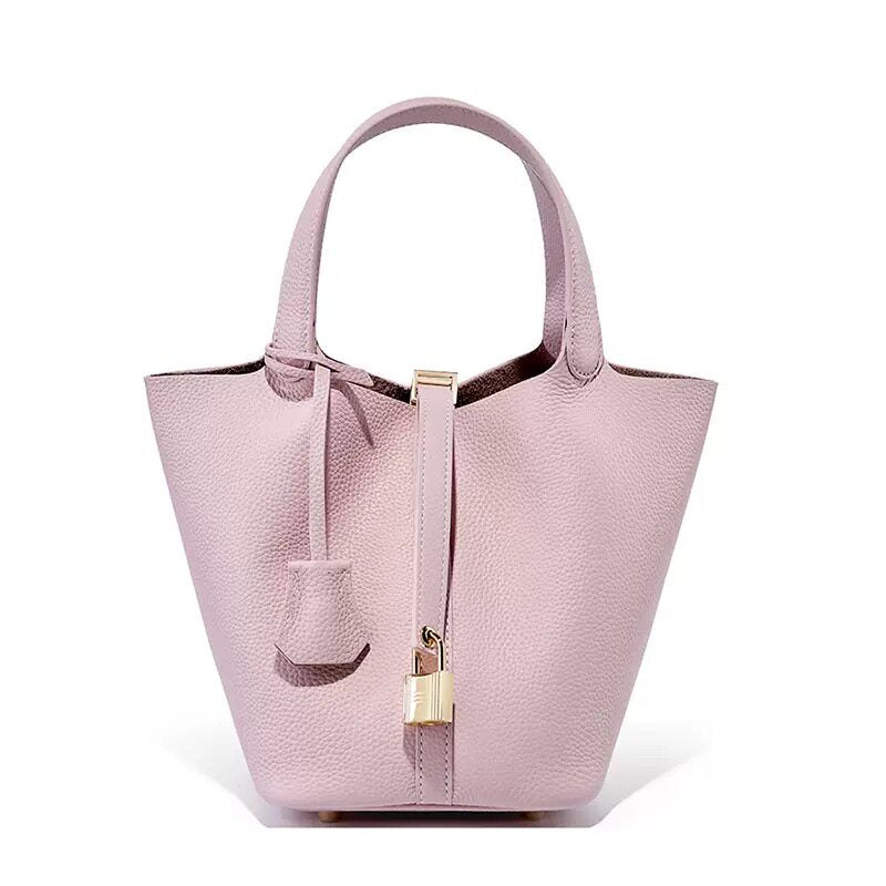 Close detail of the leather color and tone on the bucket tote