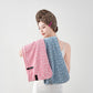Side profile of the towel hair wrap showing the twist tail and sewn button closure