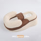 Cream and coffee brown baby positioning lounger with U-shaped bolsters, mesh panel and body strap