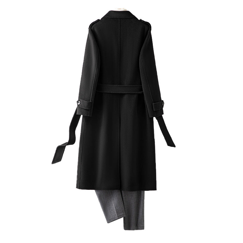 Black double faced wool coat detail of the cuff strap and sleeve
