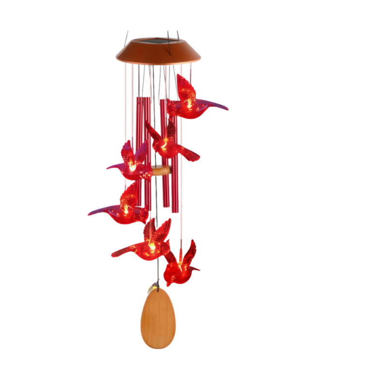 Red bird wind chime lamp with red tubes and a wooden oval pendant on a white background
