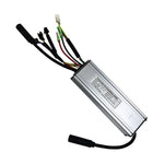 Silver aluminum dual drive e-bike controller with its label and a harness of motor, display, power, PAS and brake plugs