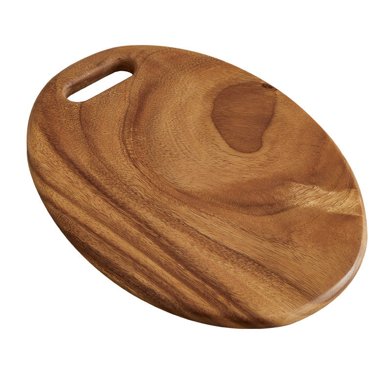 Walnut solid handle cutting board 40 by 25 cm shown with its shaped hang handle
