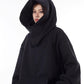 Black oversized hooded sweatshirt with the large hood framing the face and the high collar folded below it