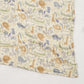 Soft cotton muslin gauze baby blanket shown folded, revealing the light open double layer weave