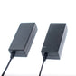 Two black desktop switching power supply cases side by side showing the top surface and cord exit