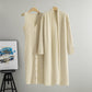 Apricot two piece ribbed knit set showing the buttoned dress beside the long open cardigan
