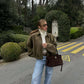 Back view of the relaxed green women's zip-up jacket
