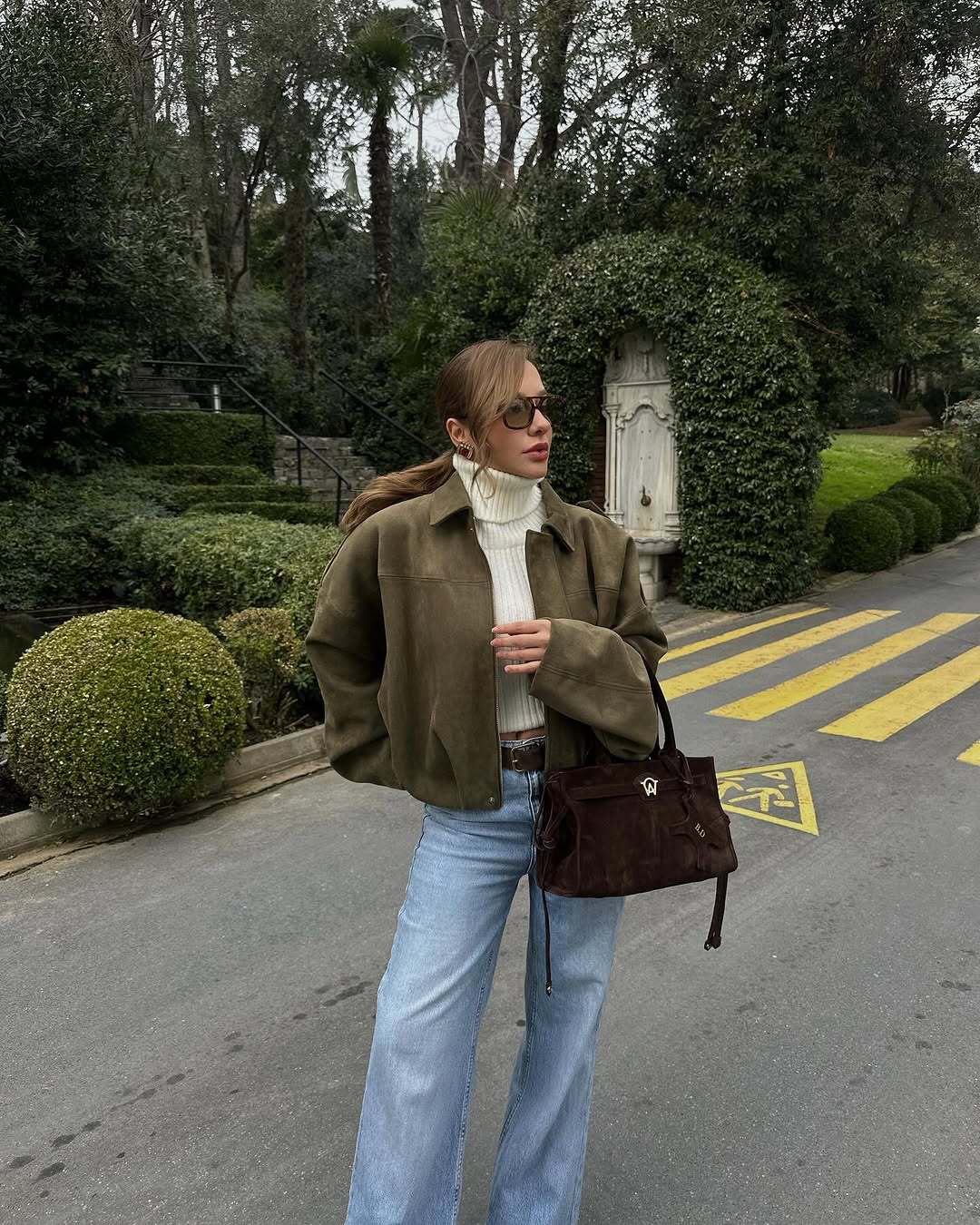 Back view of the relaxed green women's zip-up jacket