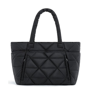 Black padded quilted nylon shoulder bag with rounded handles and a front zip pocket
