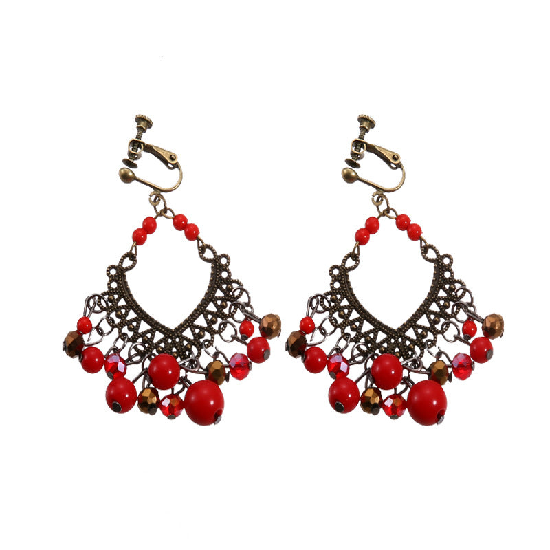 Boho vintage clip-on drop earrings with fringe and bead accents, zinc alloy build, studio image on white background