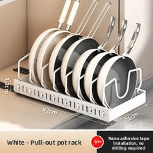 White pot rack on a pull out slide rail gliding out of a cabinet