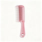 Clear crystal massage comb with wide teeth and metal tipped pins for scalp serum application