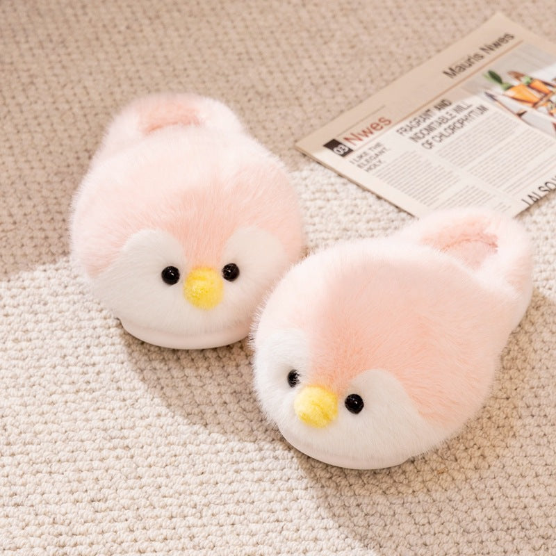 Pair of pink plush penguin slippers with yellow beaks and black eyes on a beige rug beside a newspaper, Pink Open-Heel